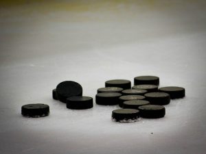 Dozen Hockey Pucks